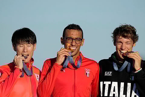 Men's Modern Pentathlon: Japan's Taishu Sato, Egypt's Ahmed Elgendy and Italy's Giorgio Malan celebrate their silver, gold and bronze medals